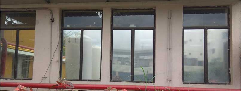 Sun control film on glazing